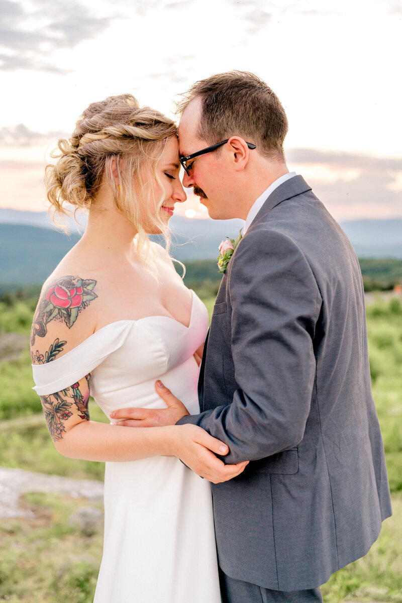 Couple sharing a quiet moment in the mountains | Maine elopement photographer | Adventure and Vows