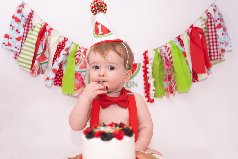A one-year-old at his cake smash photo session.