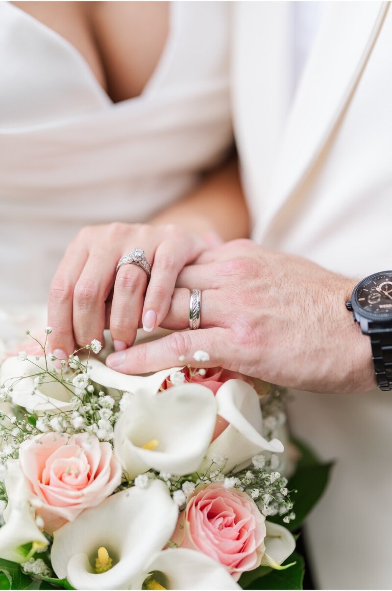 wedding rings and bouqet