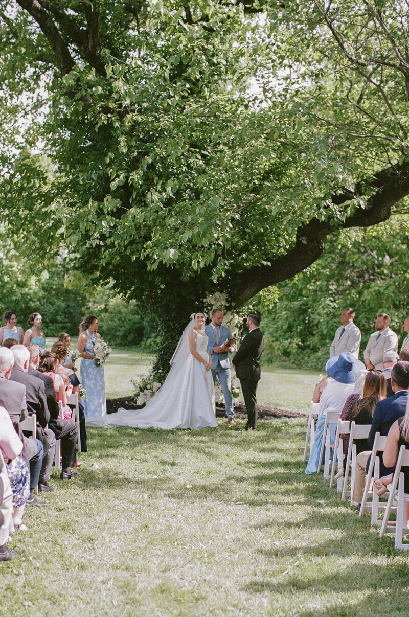 Candid outdoor moment from a Cincinnati wedding, captured on 35mm film. A timeless, documentary-style image full of natural light and real emotion.