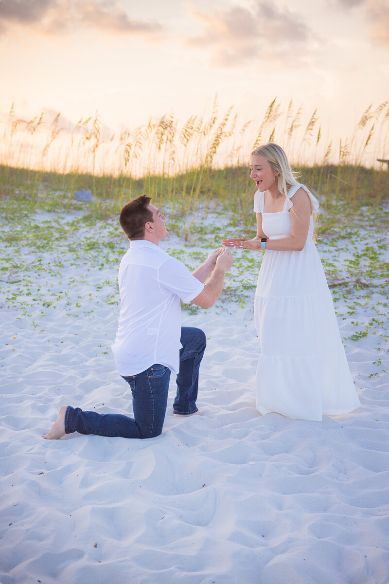Authentic look for each other as couple walks along the sand