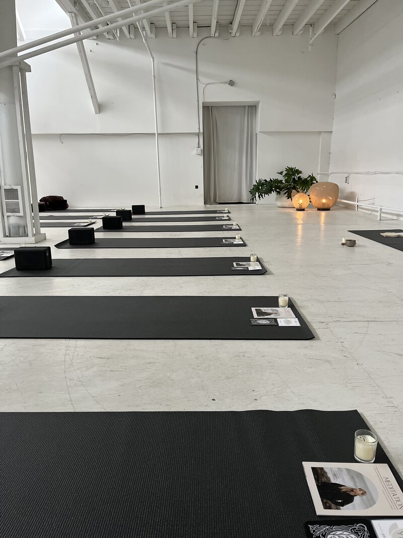 Woman gently cleansing her face with a towel during a calming skincare routine, symbolizing clean beauty, self-care, and mindful wellness practices.