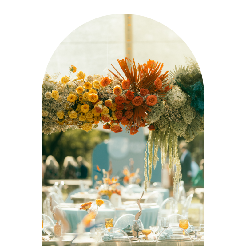 wellow orange and teal wedding floral arrangement
