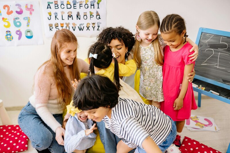 group of kids hugging coordinator 