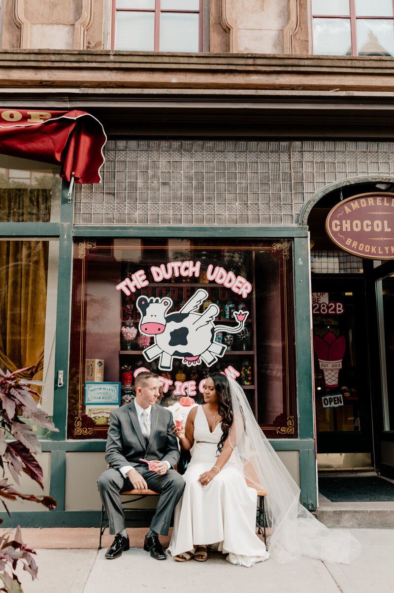New York wedding couple posing outside of chocolate shop