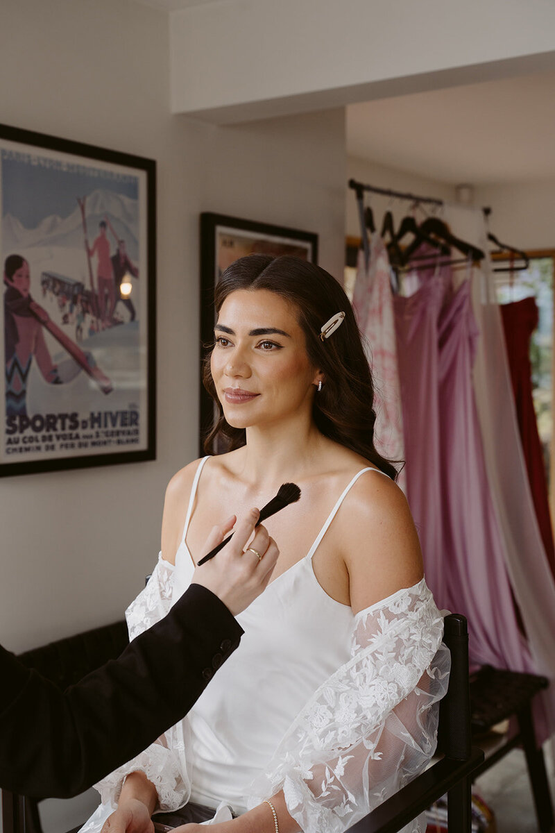 paige shipstone with makeup for bride on wedding day in queenstown