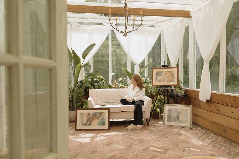 woman posing with her art during a branding session with RVA branding photographer 