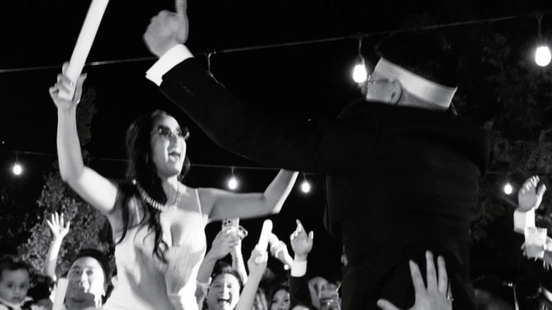 black and white image of bride and groom dancing during reception