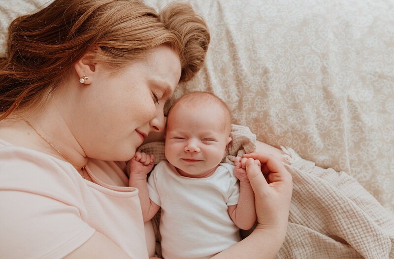 Mom and baby snuggled up at a Vancouver Newborn Photography session