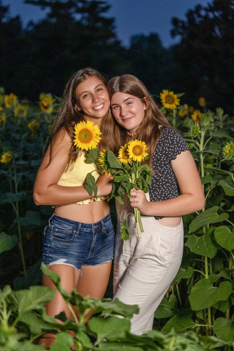 Senior hugging in the sunflower field