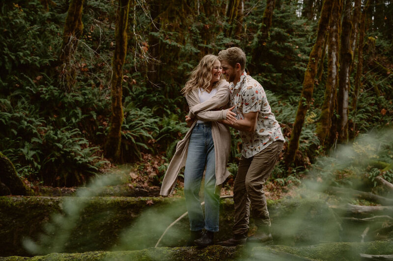 couple-spinning-intimate-smiling-forest