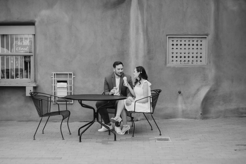 couple sitting down enjoying ice cream at Old Town, Albuquerque