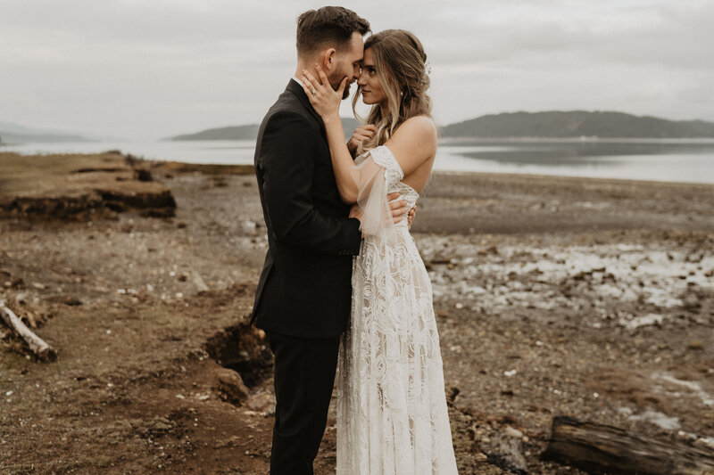 bride and groom smiling at cannon beach elopement with claudia noelle photography