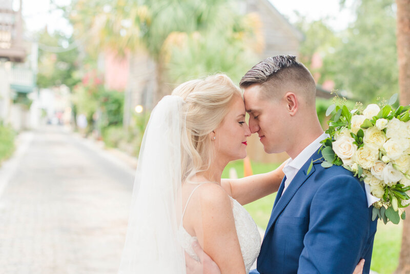 bride and groom touching noses