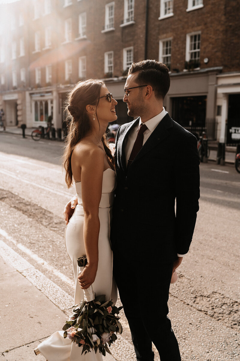 married-bride-and-groom-in-street-smiling