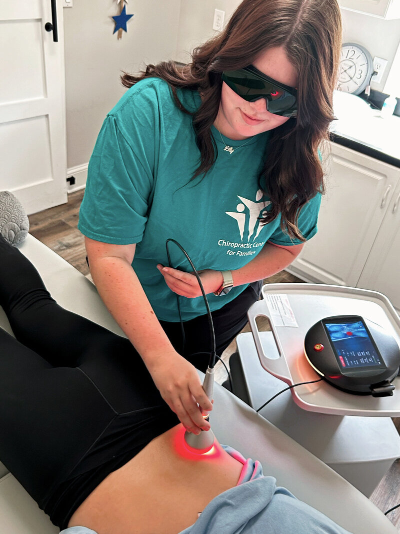 Lily performing red light therapy.