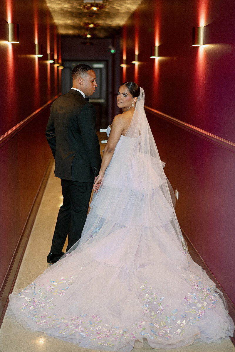 on-of-a-kind photo op for clients and couples in moody yet romantic venue hallway