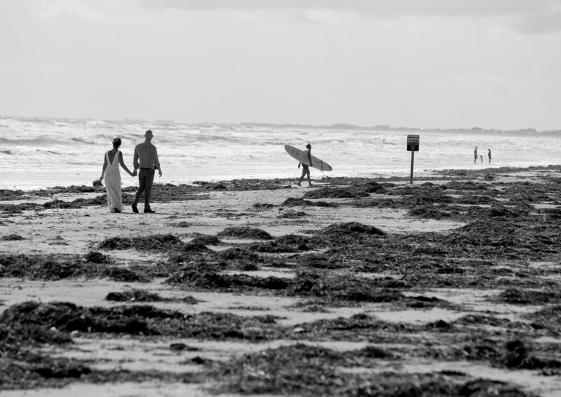Light Shifter Studios Photographs a couple walking on the beach in North Carolina. 