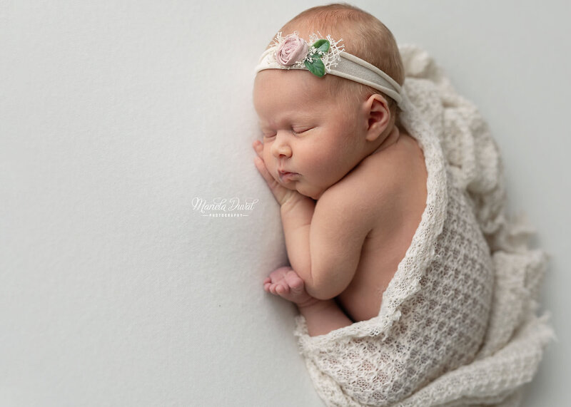 newborn neutral photo, see toes and fingers, neutral backdrop