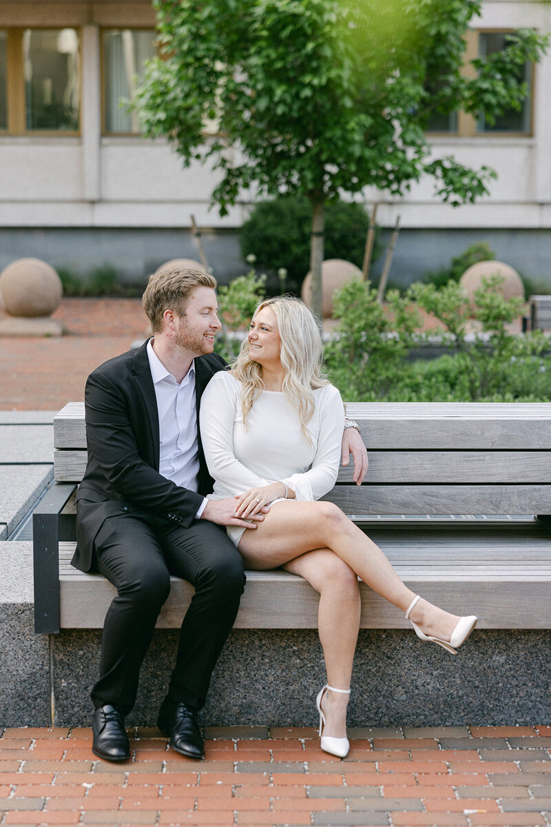 a couple sitting on a bench