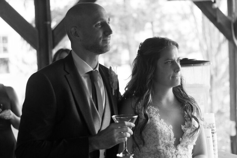 Candid moment of a bride wiping away tears during an intimate Ottawa elopement ceremony