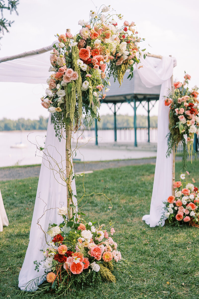Chuppah with bright florals at Glen Foerd Estate in Philadelphia, PA