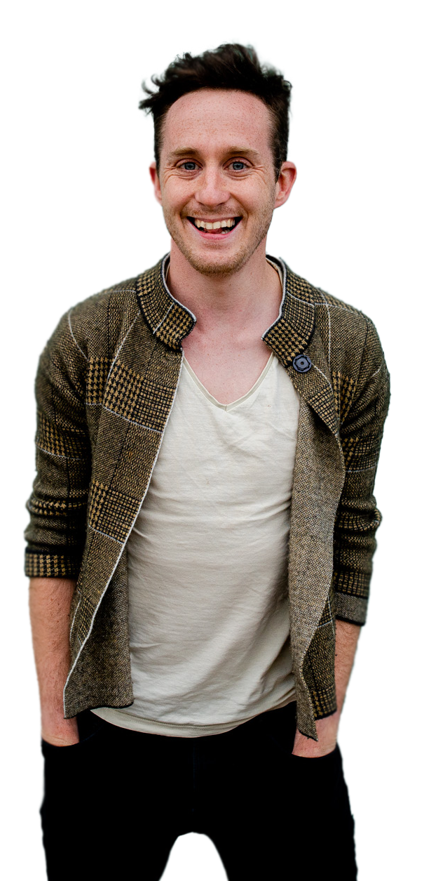portrait photo of a bristol wedding  photographer Gavin Jacob Power smiling at directly  at the camera with his hands in his pockets