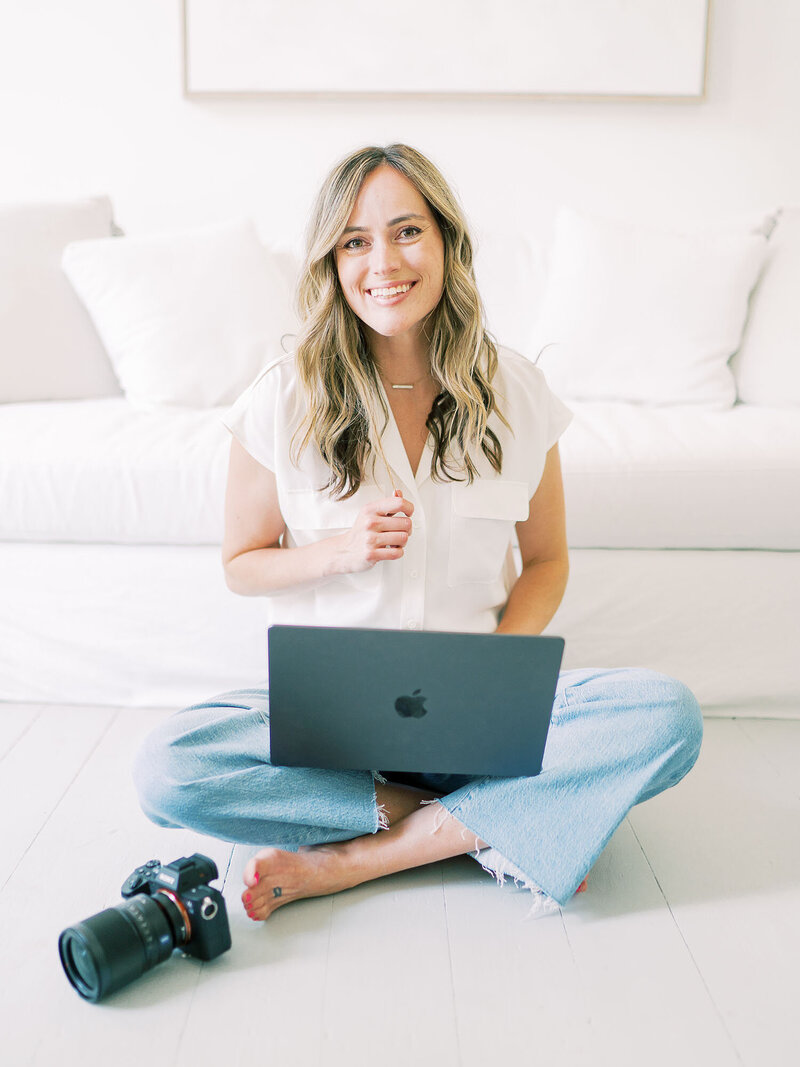 Teressa Jane sits with her laptop while working