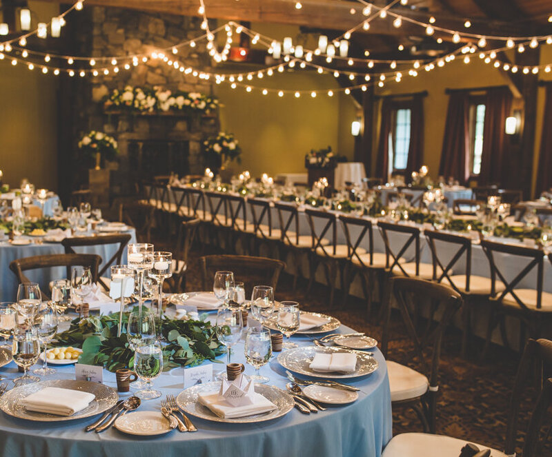 Luxury wedding reception décor with colorful centerpieces, gold accents, and modern rustic styling in the Canadian Rockies.