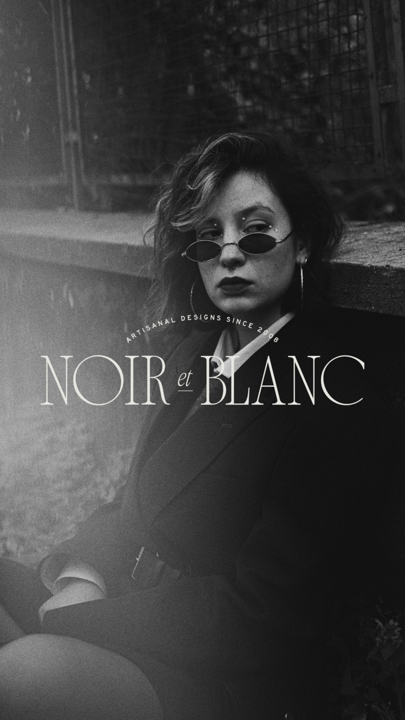 black and white image woman sitting with noir et blanc logo overlay