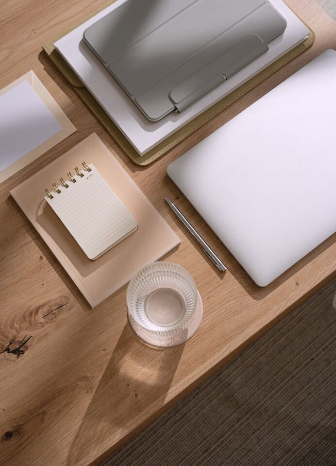 An organized desk featuring a laptop and notepad symbolizes the structured roadmap of the 'It's Okay To Stay' affair recovery program by Relationship Experts. This comprehensive program, designed for couples in the United States, Canada, and worldwide, provides a clear and effective pathway to healing and rebuilding trust after infidelity.