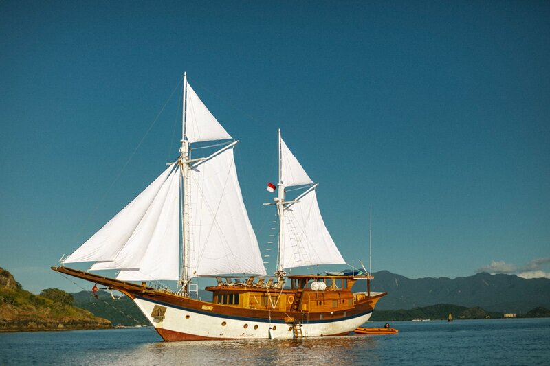 Escape to pristine white beaches and azure waters on a luxury yacht journey in Indonesia.