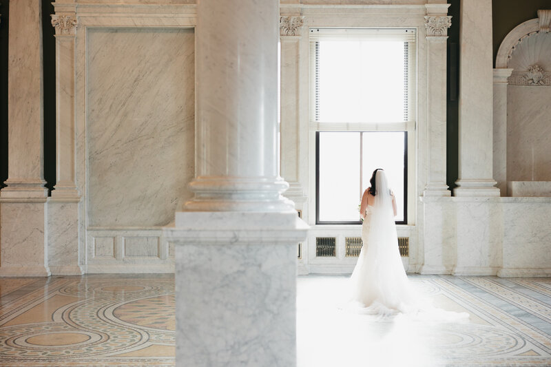 bride and groom holding hands and walking down wedding aisle