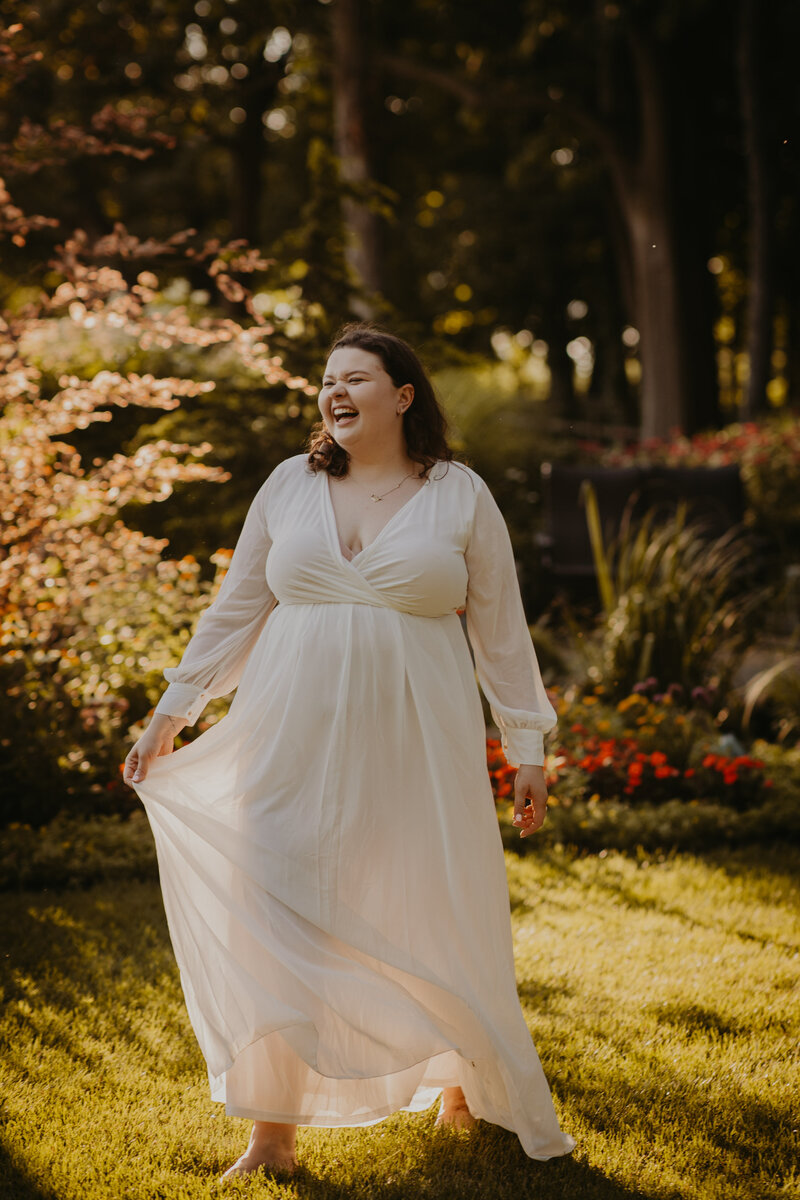 woman laughing in white dress in chicago garden