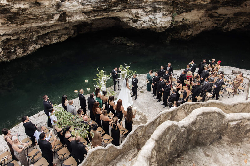 Luxury cenote wedding ceremony in Mexico with modern outdoor seating and editorial framing