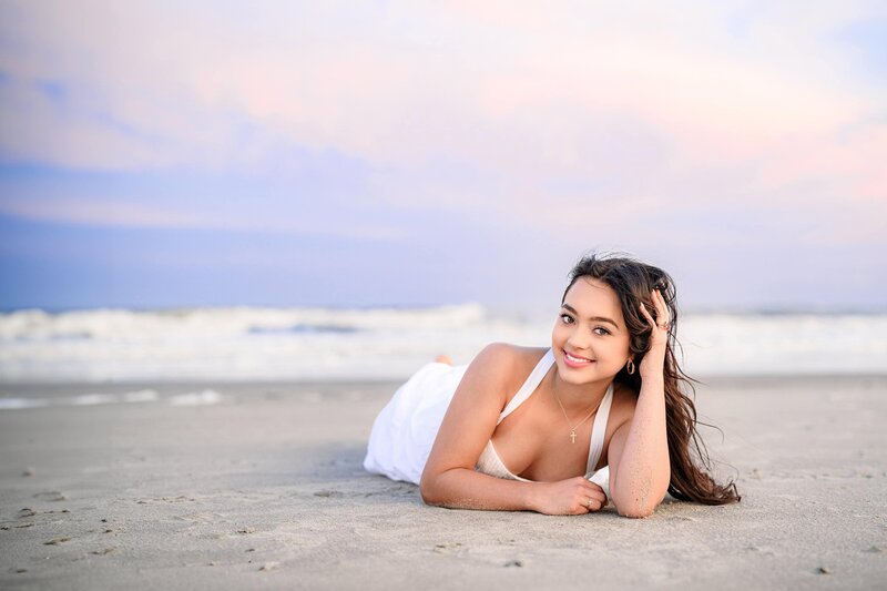 Charlotte NC senior poses on the beach  in Charleston, SC