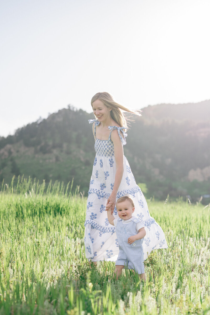 Colorado Family embracing during a sunset photoshoot with mountains in the background in the fall