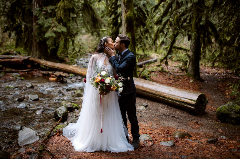 man and woman kissing in front of wedding crowd Styled Shoots for Adventurous Photographers in the Pacific Northwest