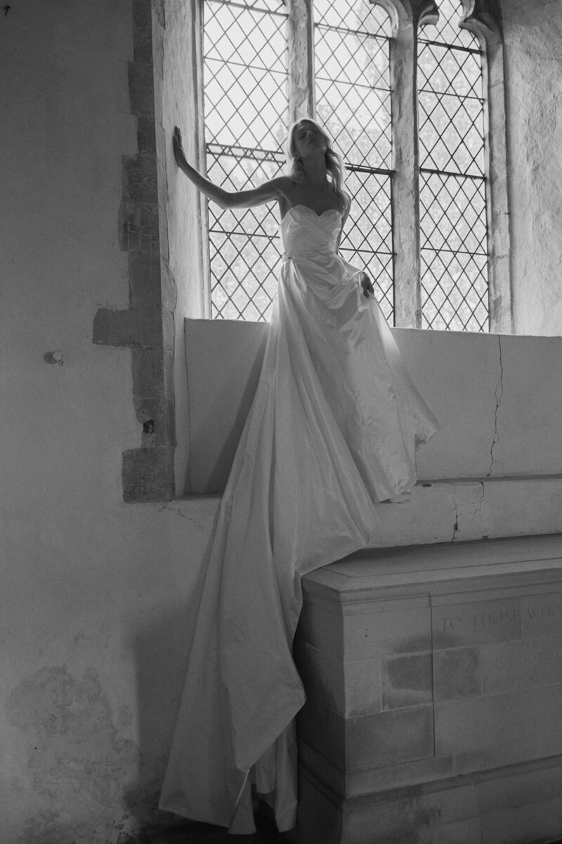 Long silk corset bridal gown by British wedding dress designer