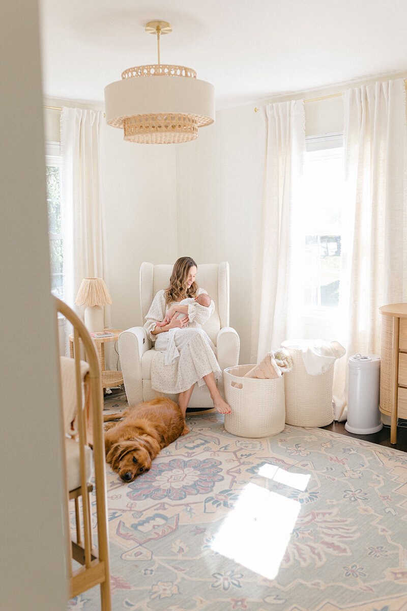 family sitting on looking at newborn baby philadelphia newborn photography