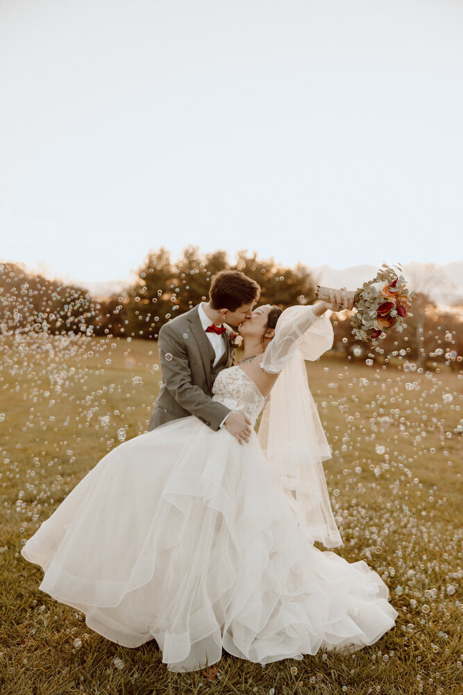 During their sunset wedding portraits at Glen Ellen Farm, this couple used a bubble machine to make their photos even more fun.