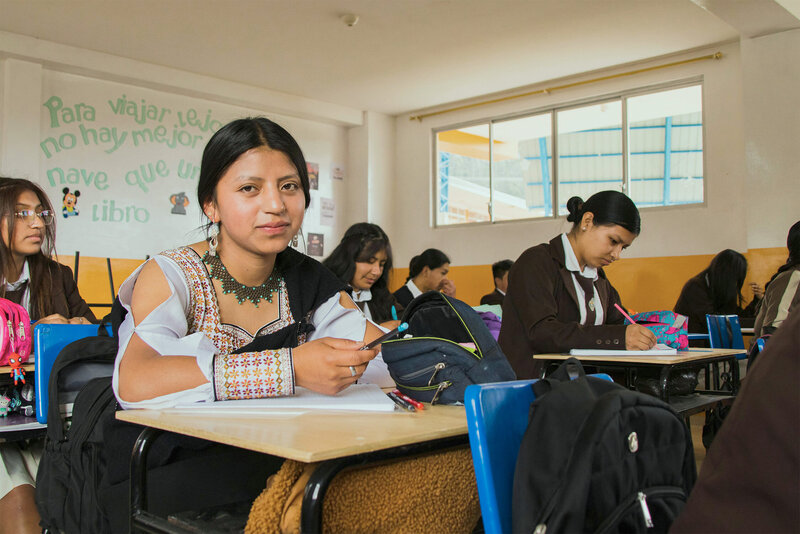 young woman sitting on an individual desk