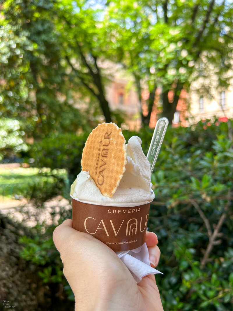 A cup of gelato with Piazza Cavour in the background
