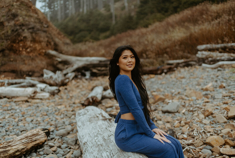 girl in blue outfit on rocky Oregon beach
