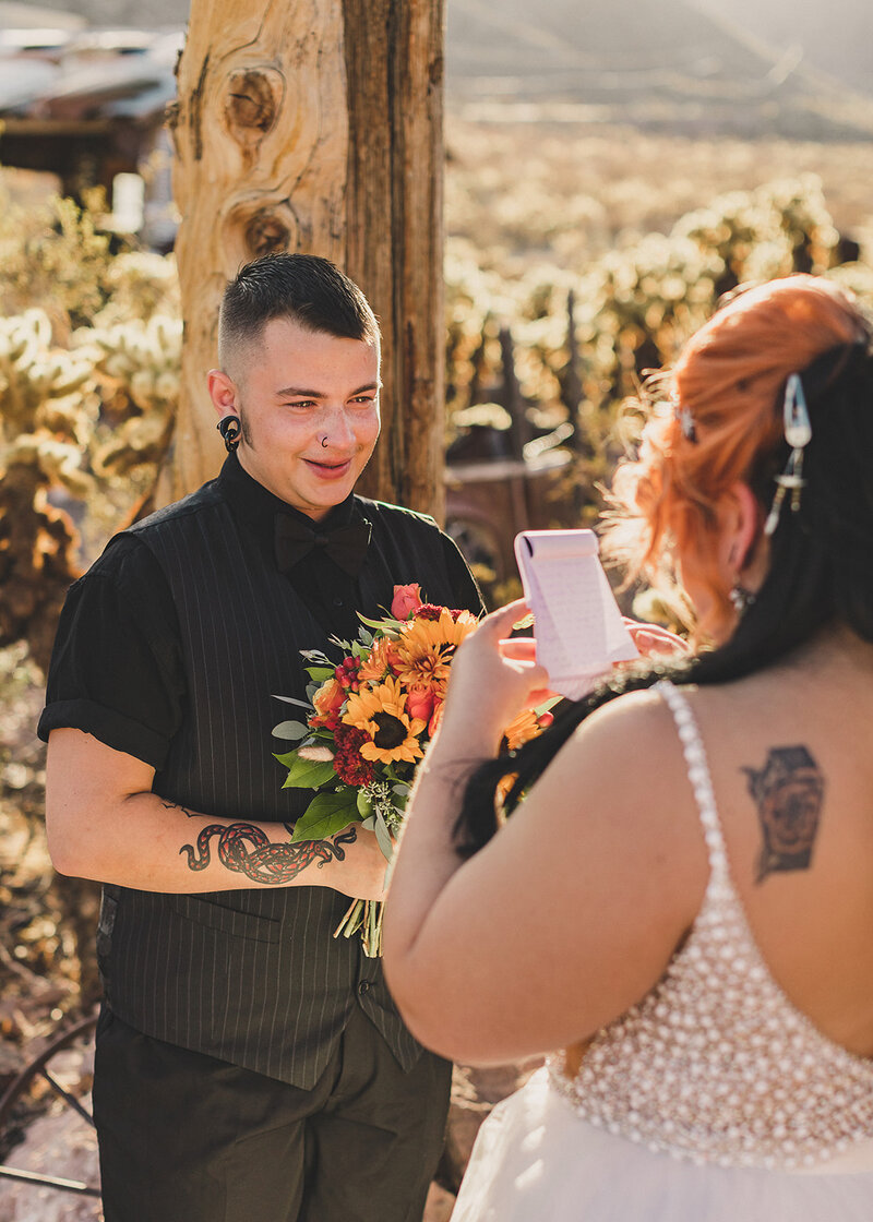 LGBTQ+ couple reciting their vows during las vegas desert elopement ceremony