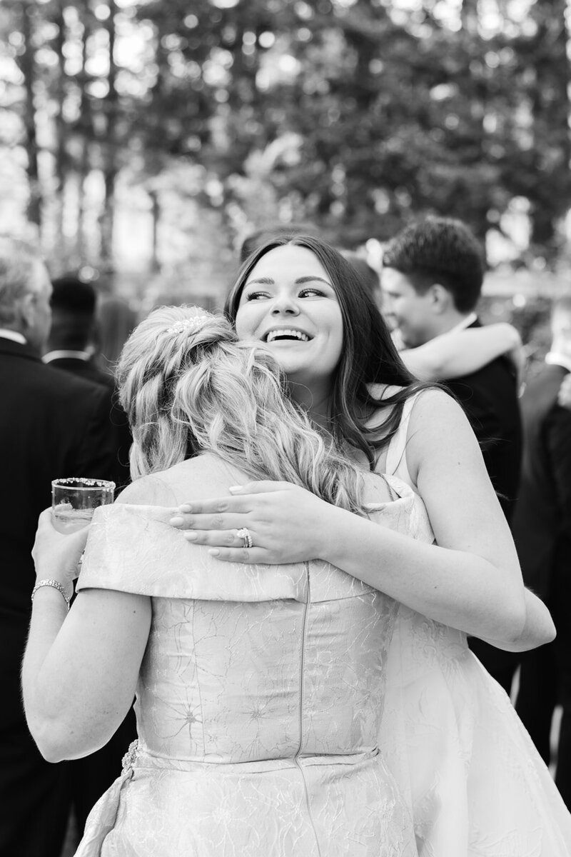 bride-hugs-mom-cocktail-hour