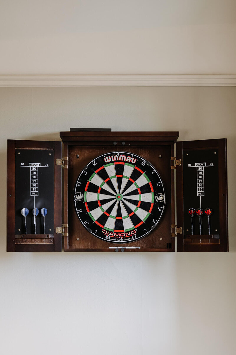 Dart board feature in the relaxed games room at Caswell House
