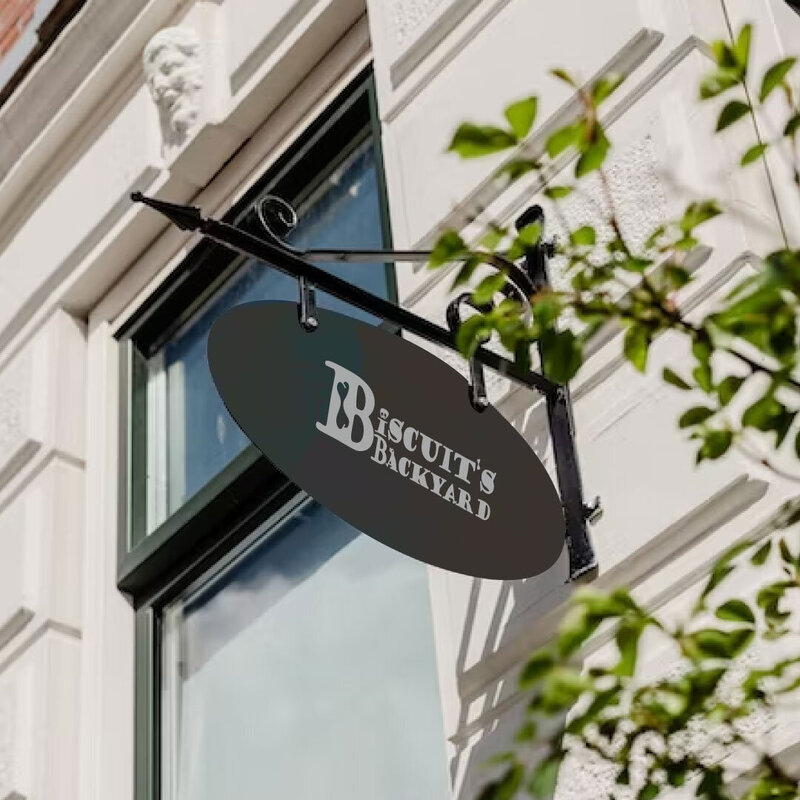 Shows the minimalist design of a logo on a signage for a Hotel and all for pets, dogs and cats.
