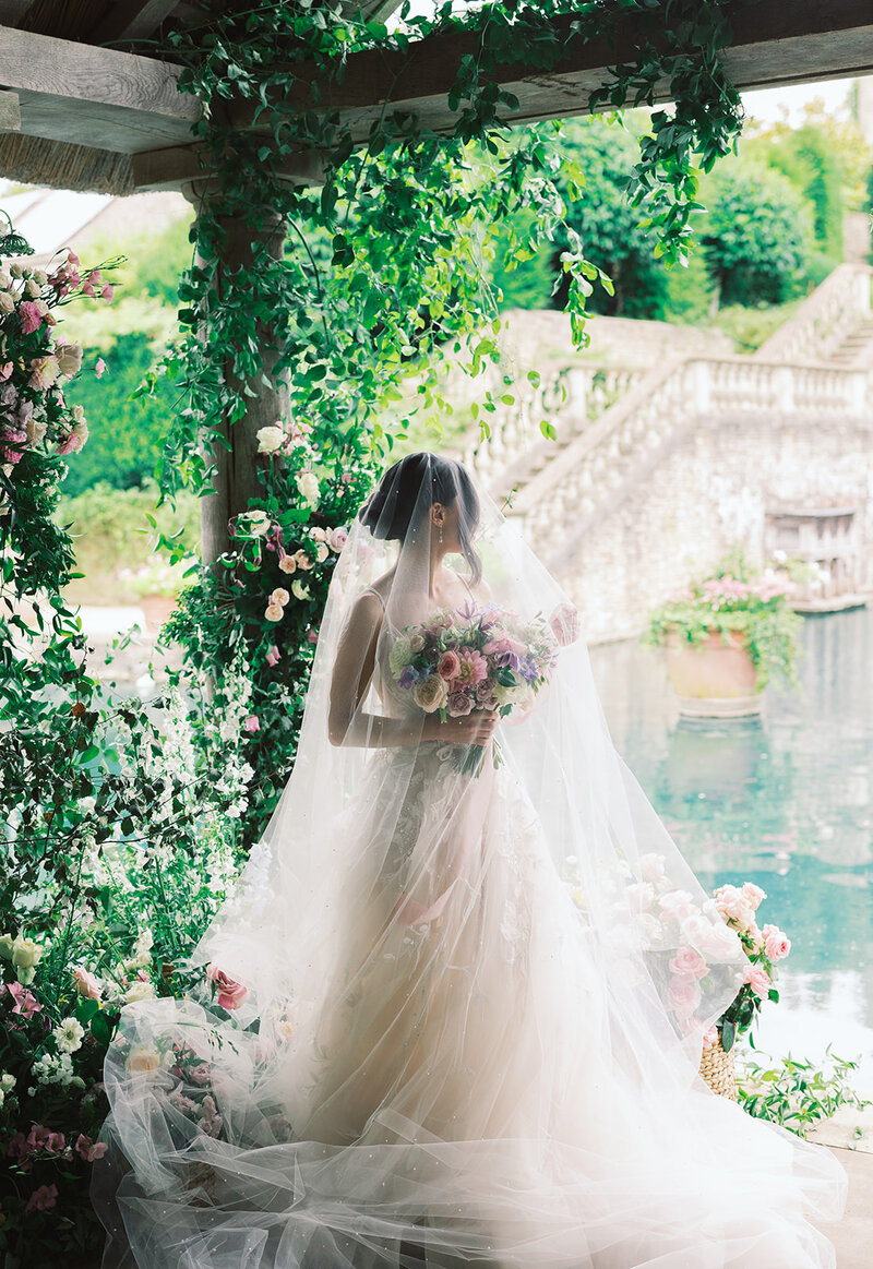 Bride stands in flowers