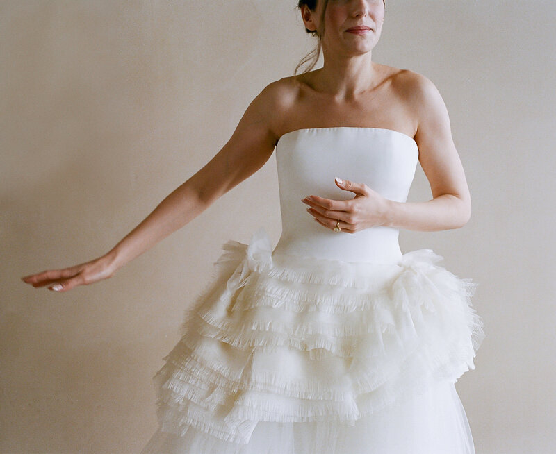 Editorial bridal portraits running through Arizona desert in wedding dress and boots | Artful portraits by Arizona luxury wedding photographer Tess Gearhart